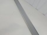 a close up of a piece of metal on a white surface
