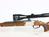 a rifle with a scope on a white background with a white background