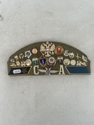 a picture of a badge with a lot of badges on it