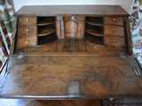 a wooden desk with a drawer on top of it