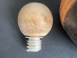 an image of a close up of a wooden ball on a table
