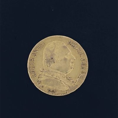 une vieille pièce d'or sur laquelle est représenté un homme