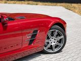 a red sports car parked on the side of the road