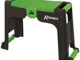 a green and black folding step stool with a handle