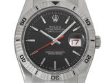 a close up of a wrist watch with a black dial