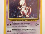 a pokemon card with a picture of a cat on it