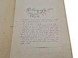 an open book with a handwritten poem on it sitting on a table