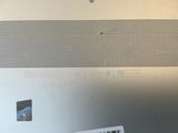 a sticker on the back of a laptop with a barcode on it