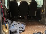 a van that has a bunch of items in the back of it