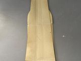 an unfinished piece of cardboard sitting on top of a table