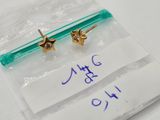 a small pair of earrings that are on top of a piece of paper