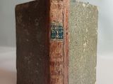 an old book that is sitting on a table