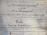 an old document with writing on it sitting on a table