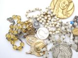 a bunch of beads and a coin on a table