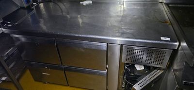 a stainless steel counter top in a commercial kitchen