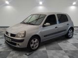 a picture of a small silver car parked in a garage