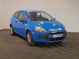 a blue car that is parked in a room