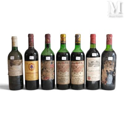 a group of six bottles of wine sitting next to each other