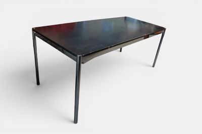 an image of a table with a black top and metal legs