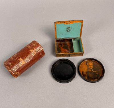 a small wooden box with a lid and a small wooden box with a lid