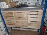 a wooden cabinet with drawers and shelves in a room