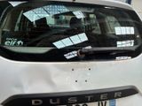 a white car with stickers on it parked in a parking lot
