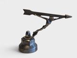 a statue of a man holding a knife on top of a bell