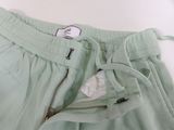mint green sweat pants with zipper pockets and zippered cuffs