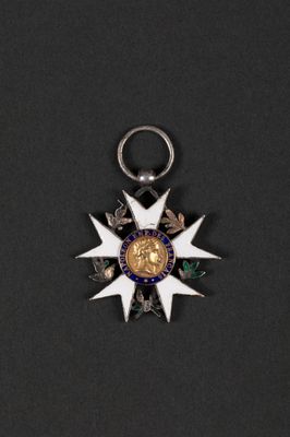 a close up of a medal on a black surface