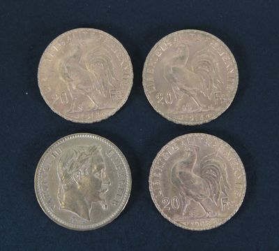 four different british coins on a blue surface