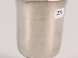a silver cup on a pedestal with a price tag on it