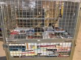 a large metal cart with a lot of books inside of it