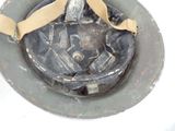 a close up of a helmet with a ribbon on it