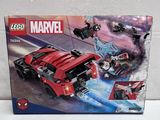 the box of the lego marvel spider - man vehicle is open