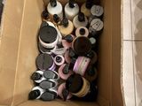 a cardboard box filled with bottles and containers of hair products