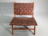 a brown leather chair with a woven seat and back