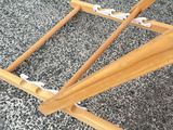 a wooden bed frame that has been made to look like it is sitting on the ground