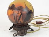 a lamp that is sitting on a stand with a cord
