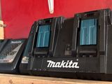 three makitt batteries sitting on top of a wooden shelf