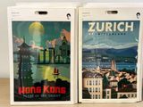 two boxes with a picture of a city on them sitting on a table