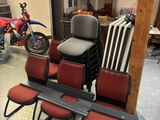 several chairs and a table in a room with a motorcycle in the background