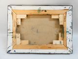 une image représentant un cadre photo maculé de peinture sur une surface blanche