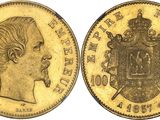 a gold sovereign coin with the head of a woman and a coat of arms