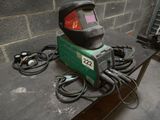 a welder that is sitting on a table in a room