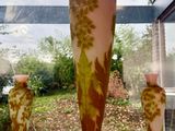three vases sitting on a window sill in front of a window