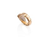 a gold ring with diamonds on a white background