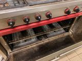 four burners on the stove in the kitchen