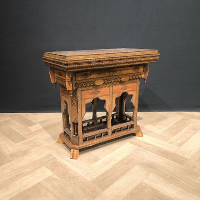 a small wooden table with a shelf on top of it