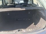 a trunk of a car with the back seats folded down