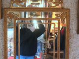 a man taking a picture of himself in a mirror